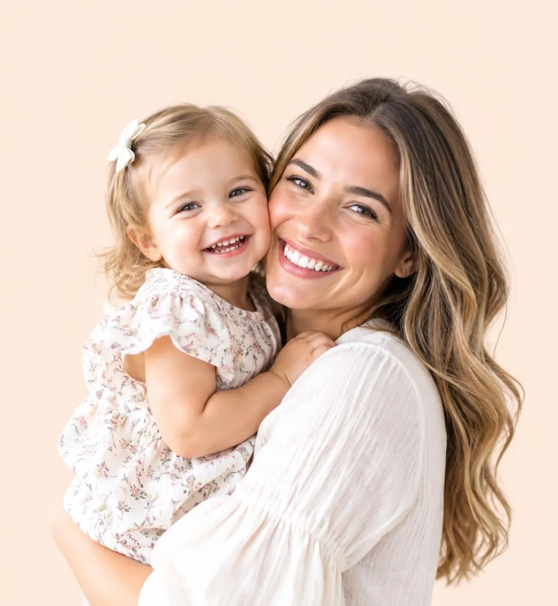 A mother smiling cheek to cheek with her toddler